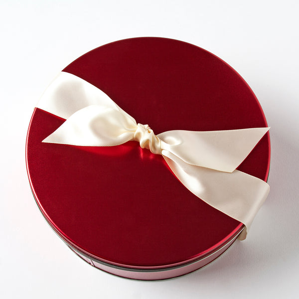 Classic chocolate covering copper kettle cooked caramel. Milk chocolate and dark chocolate with sea salt. Packaged in a beautiful red tin with a satin white ribbon.