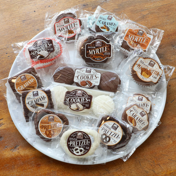 Buttery Caramel, crunchy milk-white-dark chocolate covered pretzels, cookies, Giant Peanut Butter Cup, and 3 Giant Myrtles